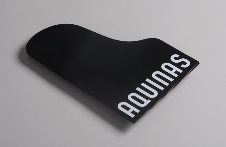 Aquinas Piano Trio die-cut invitation designed by The Joneses